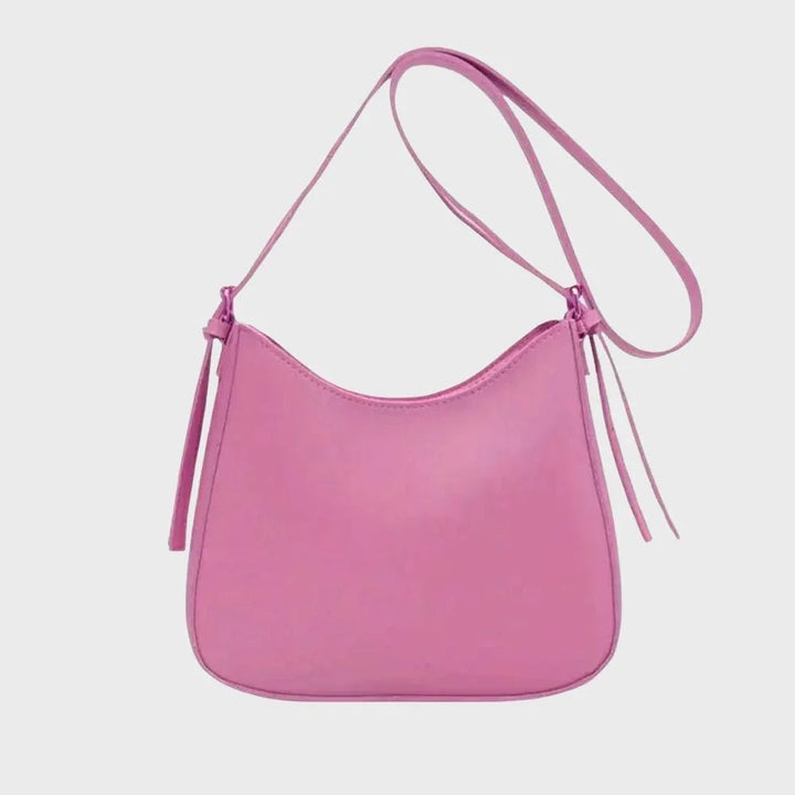 Dam Crossbody-väska med strukturerad design, guldaccenter, justerbar rem, elegant och funktionell för modern stil.