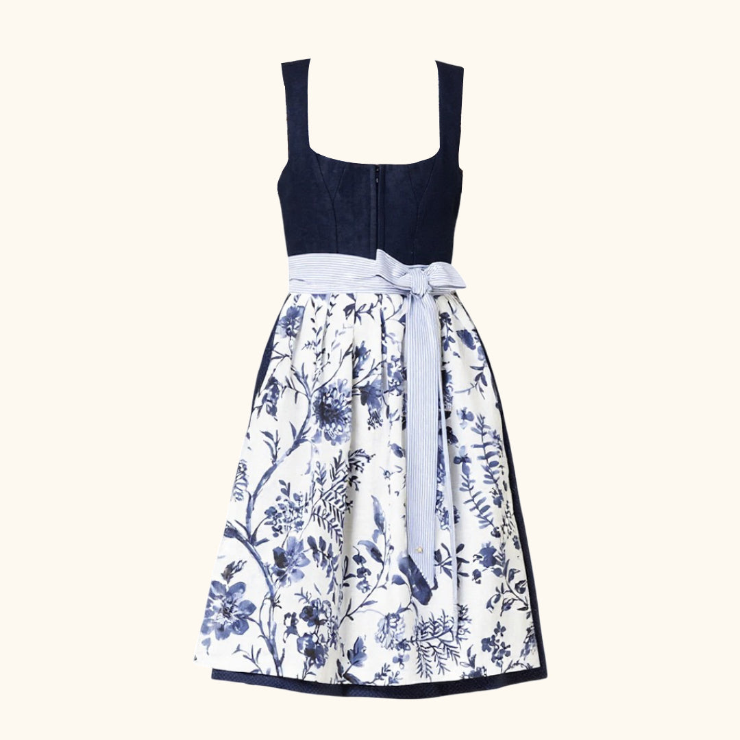 "Kvinnors dirndlklänning med blommönster, ärmlös design, axelband och glänsande schürze för festliga tillfällen."