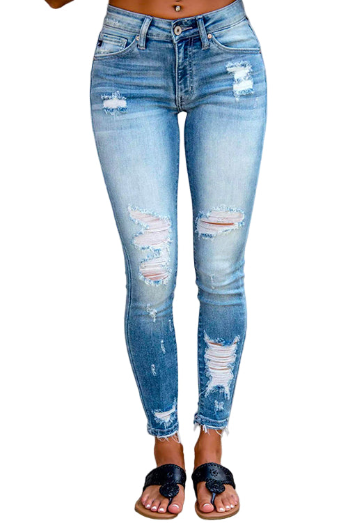 "Kvinnors distressade pencil jeans med rå fåll, ultrastretchig blå design för modern och edgy stil."