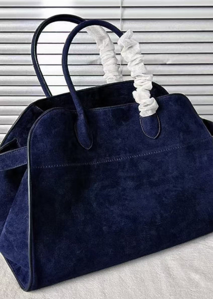 "Kvinnors gul handväska med rymlig interiör och modern design. Perfekt för jobb och fritid. Livlig färg och stilren look."