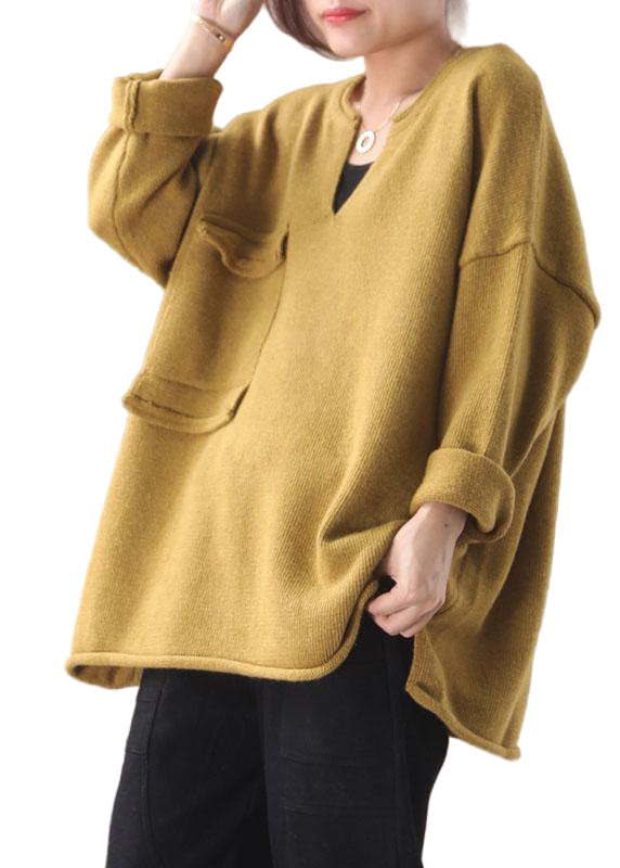 Kvinnors gul hösttopp i bomullsblandning med fickor och lösviktsdesign, perfekt för lager och höstoutfits.