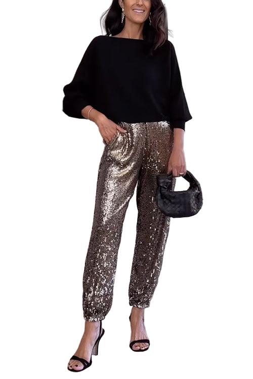 Kvinnors högmidjade glittrande joggers med skimrande paljetter, perfekt för både vardag och fest. Eleganta och bekväma.
