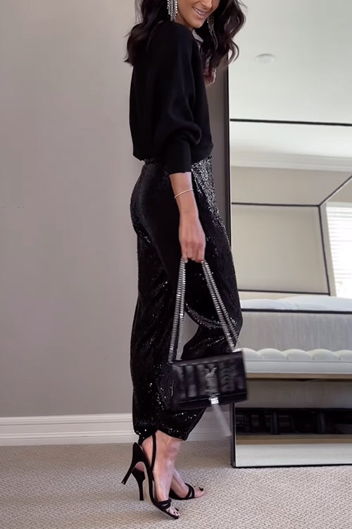 Kvinnors högmidjade glittrande joggers med skimrande paljetter, perfekt för både vardag och fest. Eleganta och bekväma.