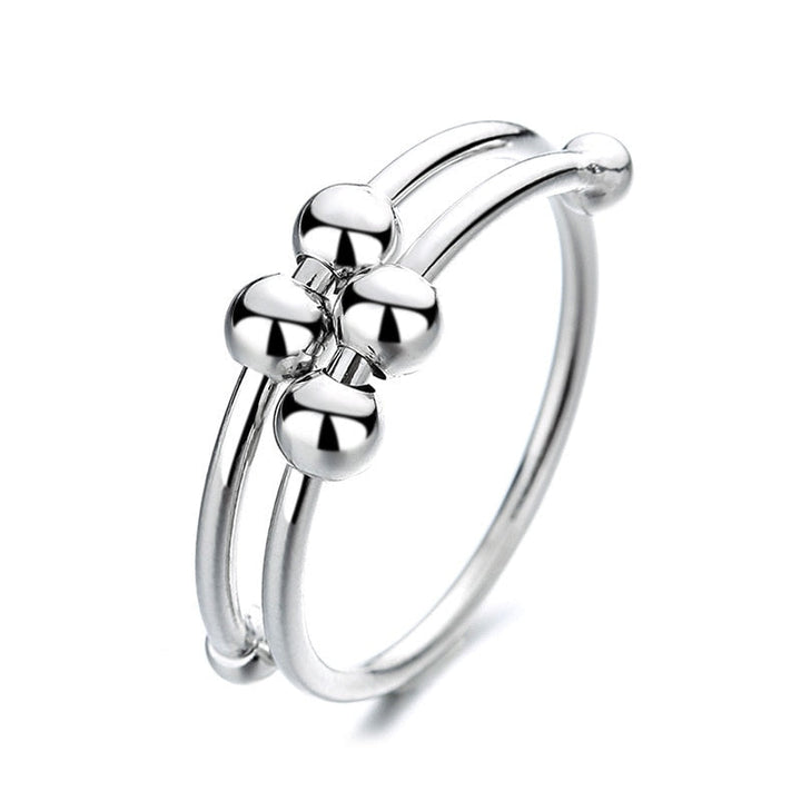 "Kvinnors justerbara fidget ring med pärlor, guld och silver, geometrisk design, lugnande accessoar mot stress."