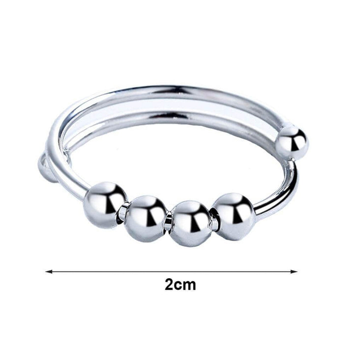 "Kvinnors justerbara fidget ring med pärlor, guld och silver, geometrisk design, lugnande accessoar mot stress."