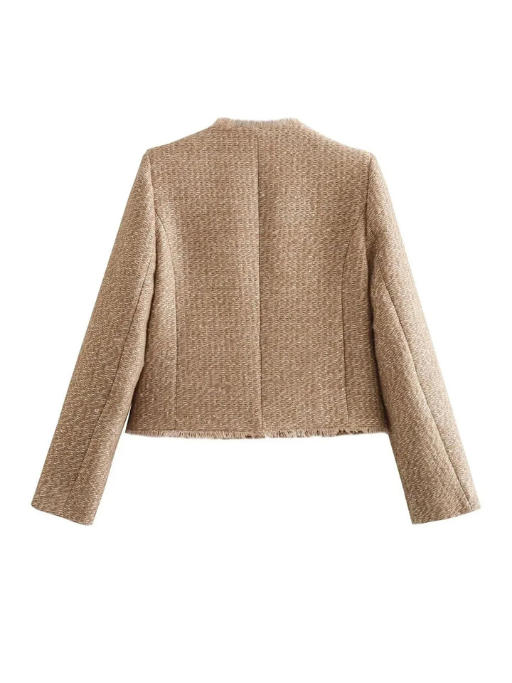 "Kvinnors klassiska vinterjacka i tweedliknande textil, trendig design, elegant och slimad, idealisk för vinterdagar."