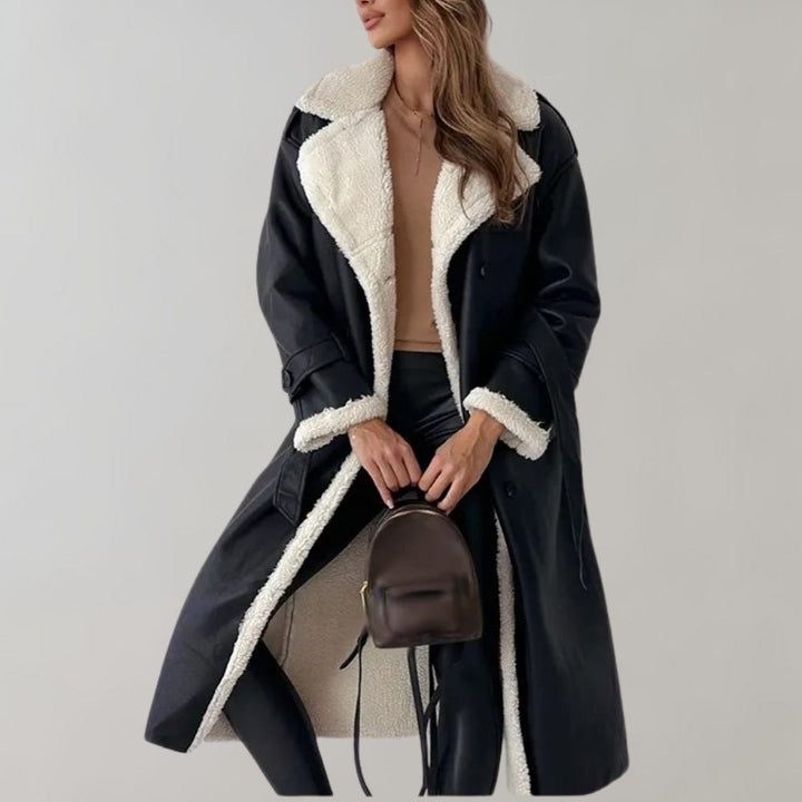 "Kvinnors lång vinterjacka framifrån, elegant och modern, vind- och vattentålig; svart, ljusbrun, beige eller brun."