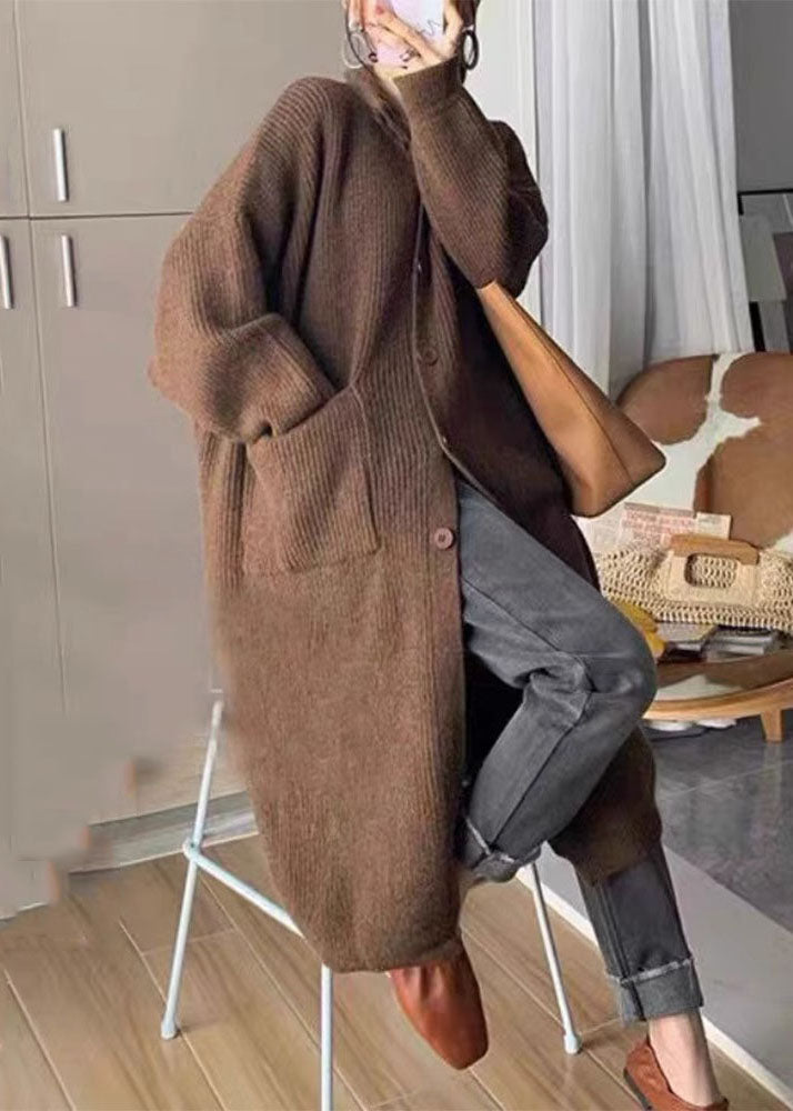 "Kvinnors långärmad polotröja med stickad design, fickor och knappar, perfekt för höst och vintermode."