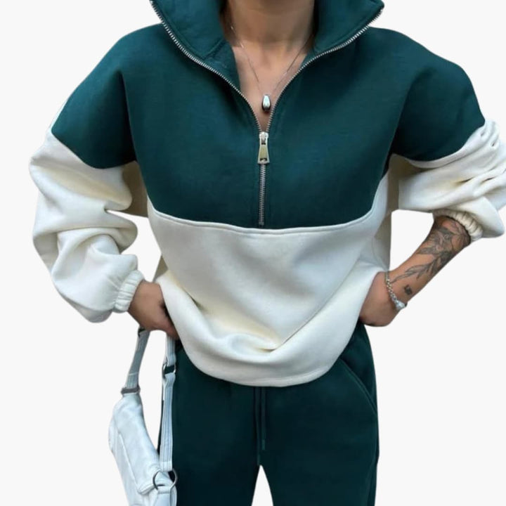 "Kvinnors modern tröja med hög hals, halv dragkedja, sidfickor och raglanärmar för elegant och praktisk stil."