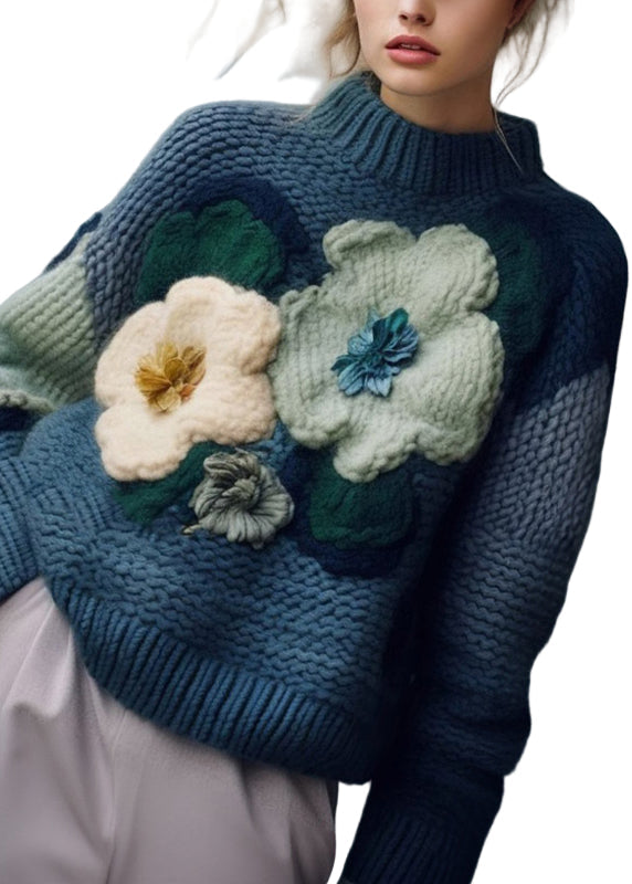 "Kvinnors mysig turtleneck tröja i art blått med patchwork-mönster och mjuk stickad textur, perfekt för kyliga dagar."