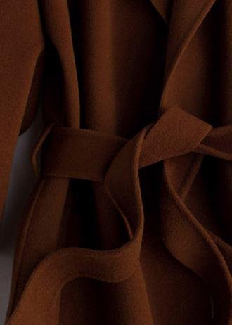 "Kvinnors oversize brun trenchcoat i ullblandning med midjeband; modern stil, elegant och bekväm look."
