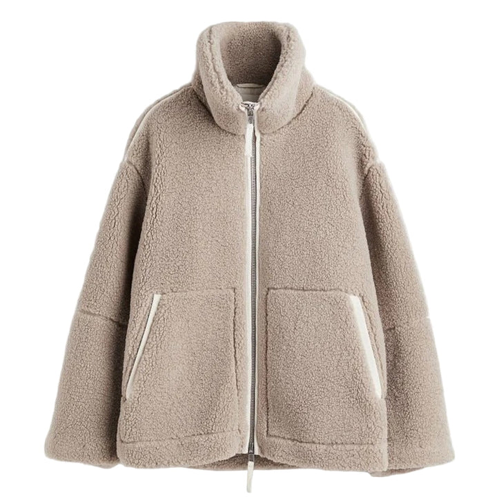"Kvinnors oversize jacka i beige polyester med varm foder och trendig design, perfekt för kalla dagar."