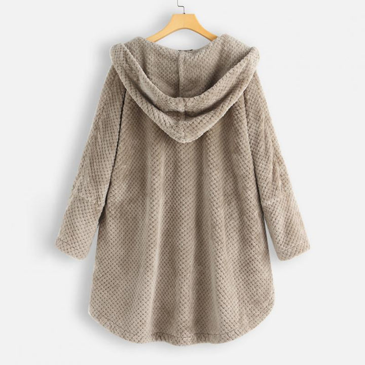 "Kvinnors oversized huvjacka i mjukt, texturerat tyg, perfekt för mysiga, stilmedvetna lager-på-lager outfits."