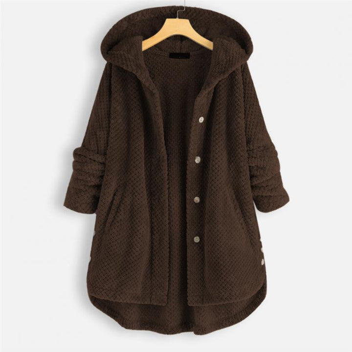 "Kvinnors oversized huvjacka i mjukt, texturerat tyg, perfekt för mysiga, stilmedvetna lager-på-lager outfits."