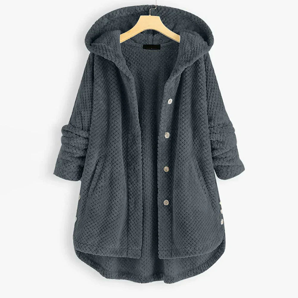 "Kvinnors oversized huvjacka i mjukt, texturerat tyg, perfekt för mysiga, stilmedvetna lager-på-lager outfits."
