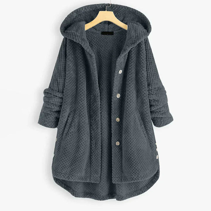 "Kvinnors oversized huvjacka i mjukt, texturerat tyg, perfekt för mysiga, stilmedvetna lager-på-lager outfits."