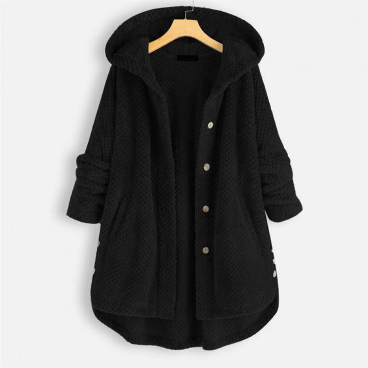 "Kvinnors oversized huvjacka i mjukt, texturerat tyg, perfekt för mysiga, stilmedvetna lager-på-lager outfits."