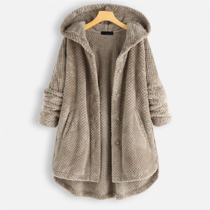 "Kvinnors oversized huvjacka i mjukt, texturerat tyg, perfekt för mysiga, stilmedvetna lager-på-lager outfits."