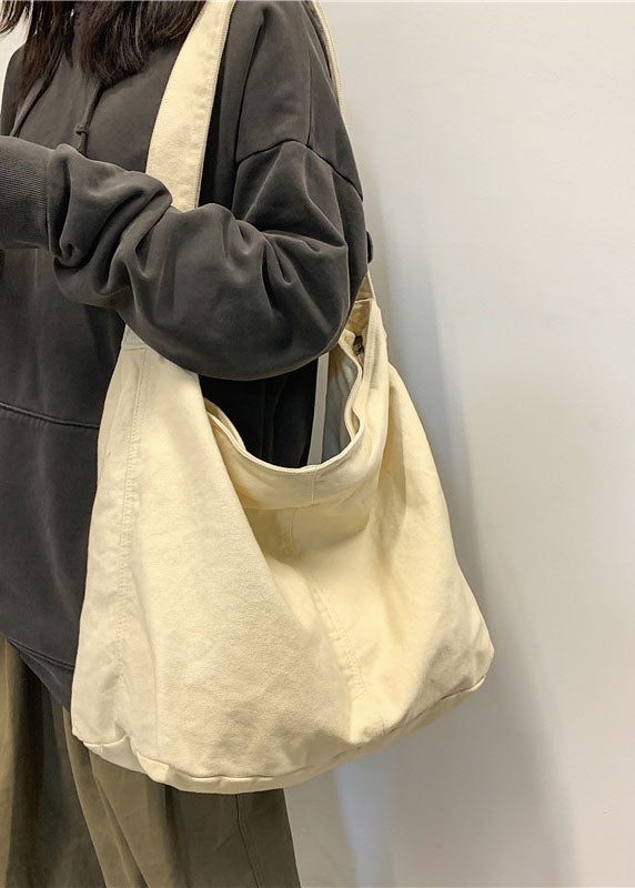 Kvinnors retro handväska i vit canvas med stor kapacitet. Vintage design, rymlig med elegant och tidlös look.
