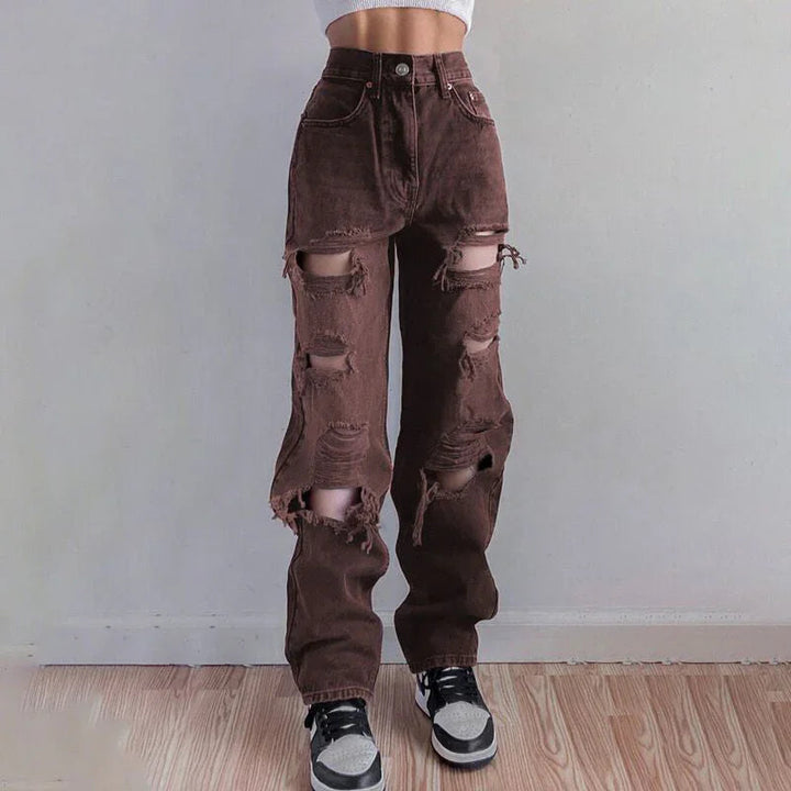 "Kvinnors rippade jeans med rå fåll, avslappnad passform, moderna och edgy, perfekt för unik stil och komfort."