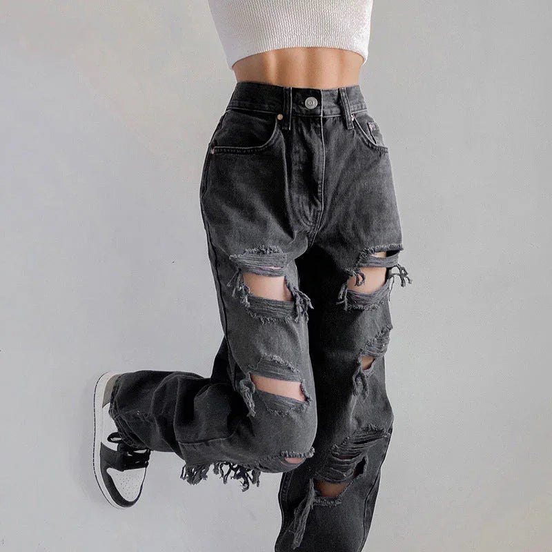 "Kvinnors rippade jeans med rå fåll, avslappnad passform, moderna och edgy, perfekt för unik stil och komfort."