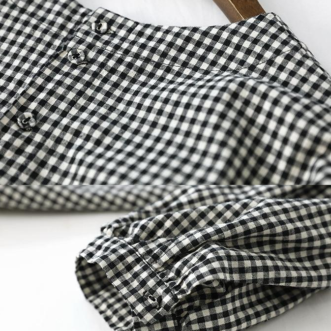 "Kvinnors rutig asymmetrisk blus i bomullsblandning, modern design, bekväm passform, perfekt för alla tillfällen."