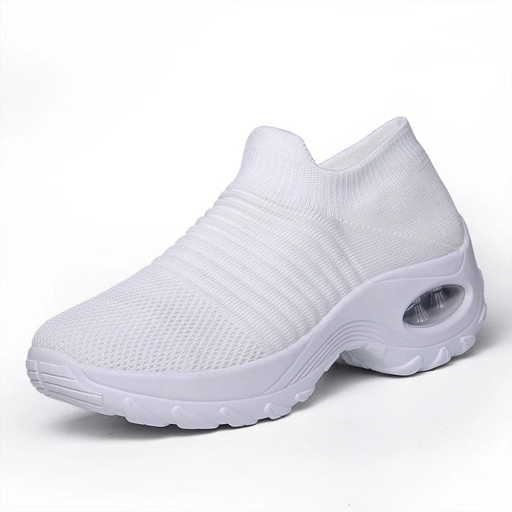Kvinnors sneakers med tjock sula och luftkudde i flera färger, modern design för stil och komfort.