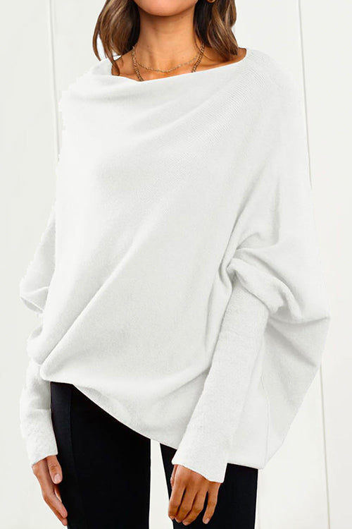 "Kvinnors stickad tröja med fladdermusärm i mjuk bomullsblend för elegant och modern look, ideal för alla tillfällen."