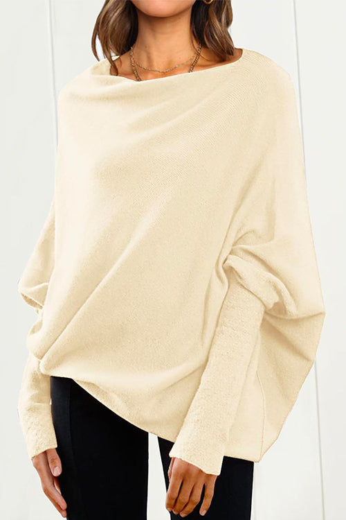 "Kvinnors stickad tröja med fladdermusärm i mjuk bomullsblend för elegant och modern look, ideal för alla tillfällen."
