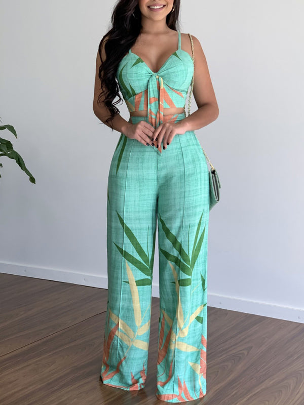 "Kvinnors tvådelat set med V-ringad topp och högmidjade vida byxor i polyester, elegant och avslappnad stil."