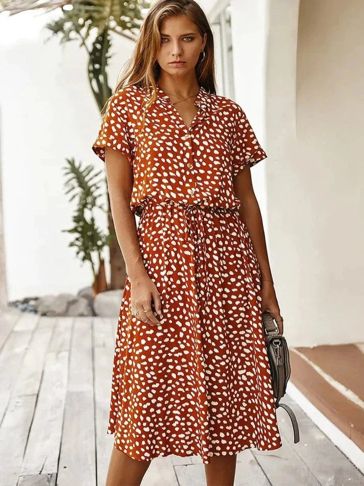 "Kvinnors vintage leopardmönstrad klänning med medelärmar, elegant stil, lätt material, perfekt för alla tillfällen."