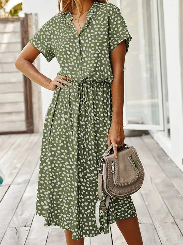 "Kvinnors vintage leopardmönstrad klänning med medelärmar, elegant stil, lätt material, perfekt för alla tillfällen."