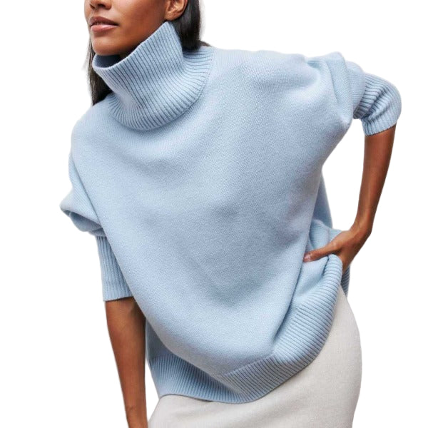 "Kvinnors vintertröja med rullhals, mjuk textur i klassiska färger som beige och blå, perfekt för kallt väder."