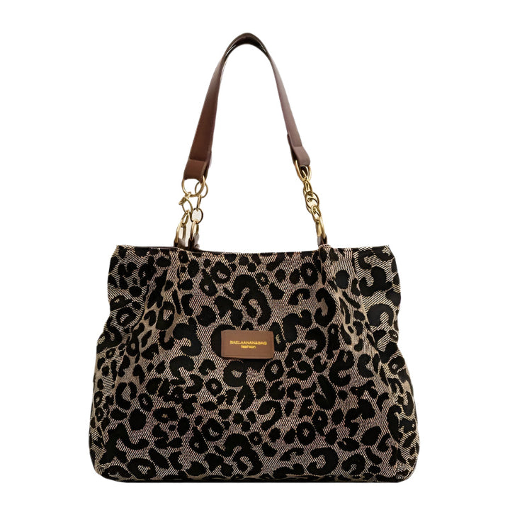 Leopardmönstrad canvas tote bag för damer med elegant design och säker dragkedja; perfekt accessoar för stil och funktionalit