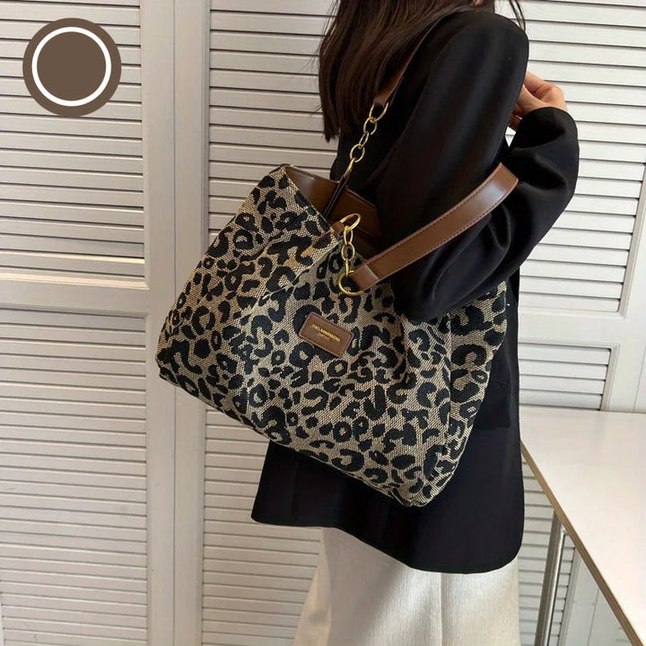 Leopardmönstrad canvas tote bag för damer med elegant design och säker dragkedja; perfekt accessoar för stil och funktionalit