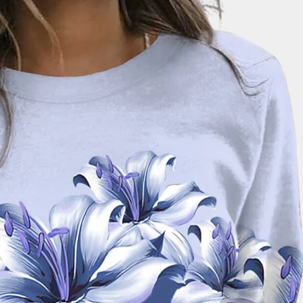"Långärmad damtröja i bomullsblandning med elegant blommönster, perfekt för stil och komfort."