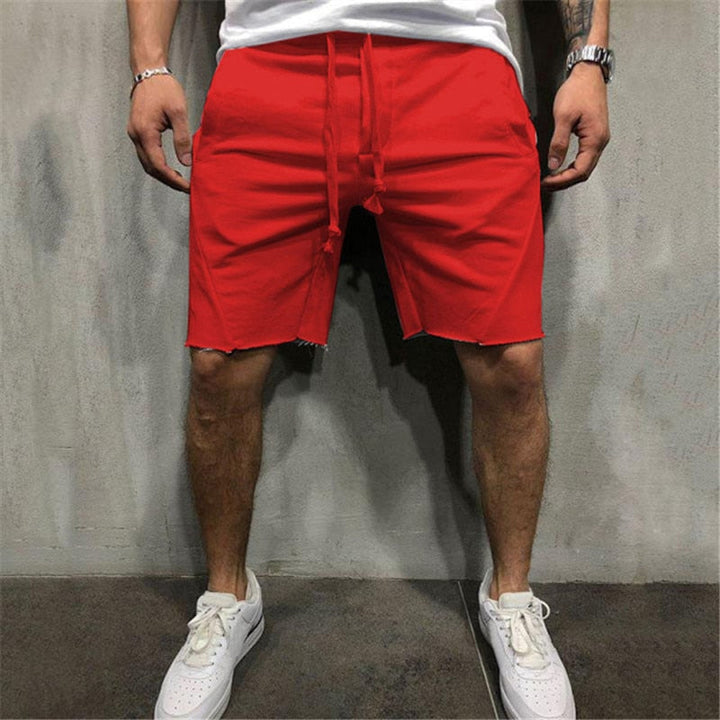 Lösa herrshorts i andningsbart tyg med dragsko och elastiskt midjeband, perfekt för sommar och fritidsaktiviteter.