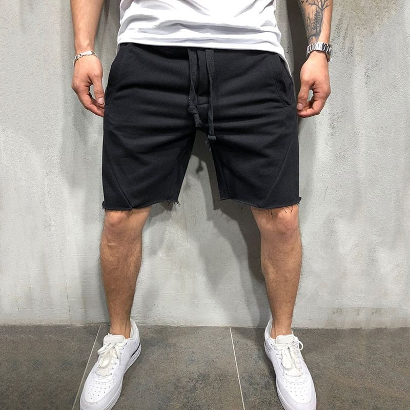 Lösa herrshorts i andningsbart tyg med dragsko och elastiskt midjeband, perfekt för sommar och fritidsaktiviteter.