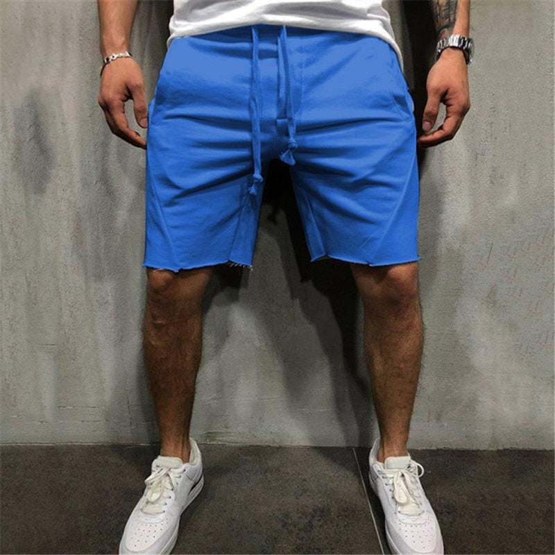 Lösa herrshorts i andningsbart tyg med dragsko och elastiskt midjeband, perfekt för sommar och fritidsaktiviteter.