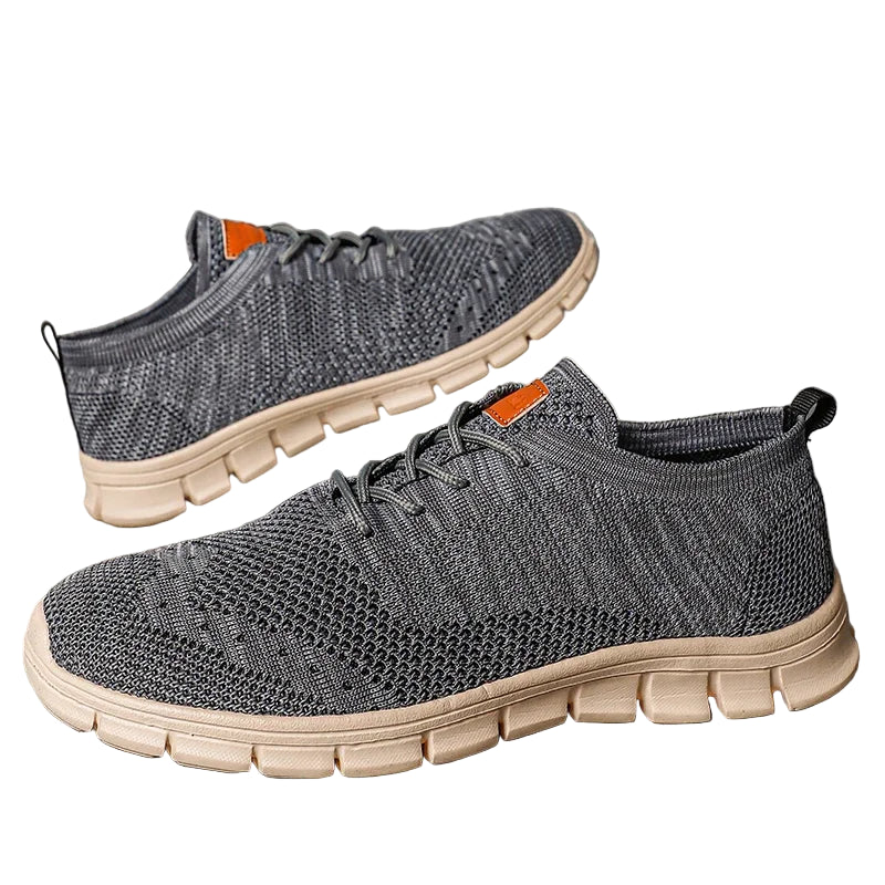 "Lätta andningsbara herrsneakers med stilren design, textil och syntetmaterial i svart, grå och blå färg."