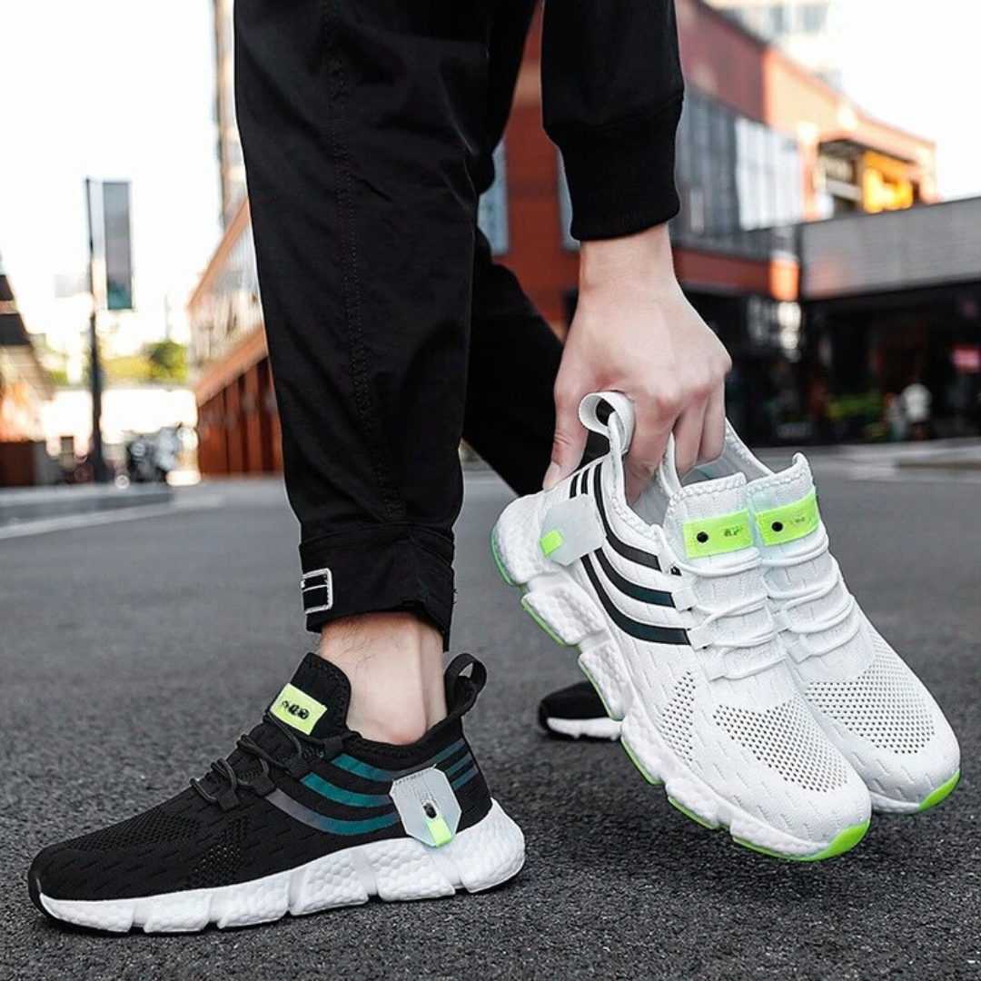 "Lätta gym sneakers för män i stilren design, svart mesh-ovandel, vit gummisula, perfekt för träning och vardagsbruk."