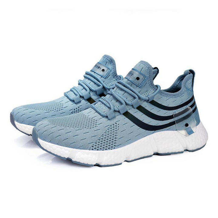 "Lätta gym sneakers för män i stilren design, svart mesh-ovandel, vit gummisula, perfekt för träning och vardagsbruk."