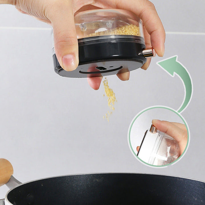 "Magnetiska kryddburkar i glas och ABS för stilren och praktisk kryddförvaring på väggen, med ergonomisk design."