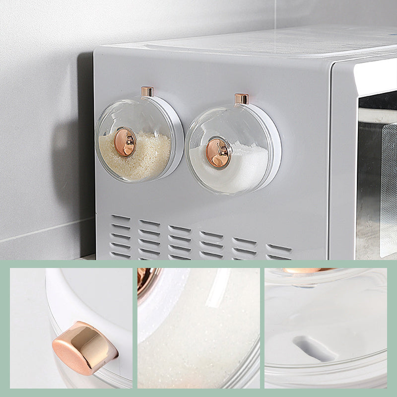 "Magnetiska kryddburkar i glas och ABS för stilren och praktisk kryddförvaring på väggen, med ergonomisk design."