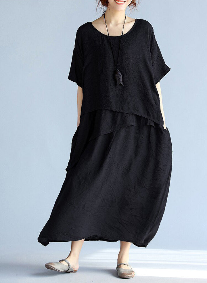 Maxi klänning dam med långa ärmar, luftig och oversized design. Perfekt för avslappnade och formella tillfällen.