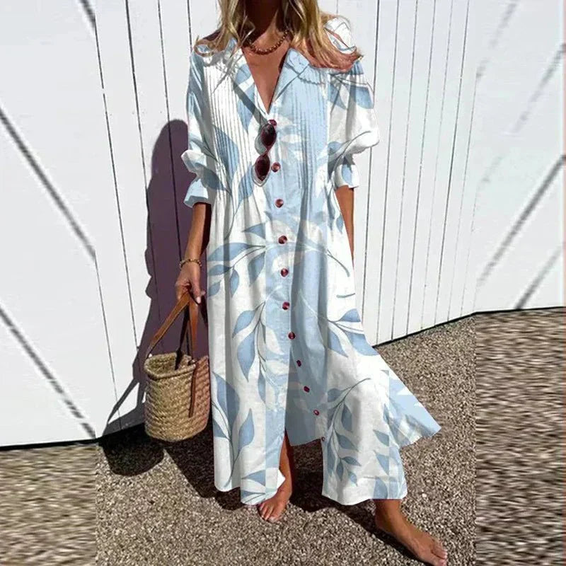 "Maxiflödande boho-klänning i lätt material, färgglada toner, perfekt för sommar och fest, luftig och elegant design."