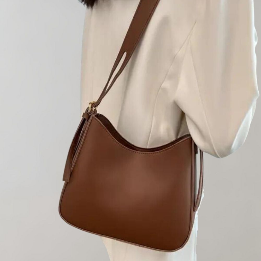 Minimalistisk crossbody handväska för kvinnor, elegant design, ergonomisk, flera färger, perfekt för alla tillfällen.