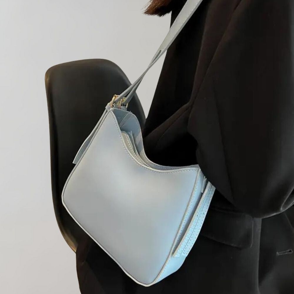 Minimalistisk crossbody handväska för kvinnor, elegant design, ergonomisk, flera färger, perfekt för alla tillfällen.