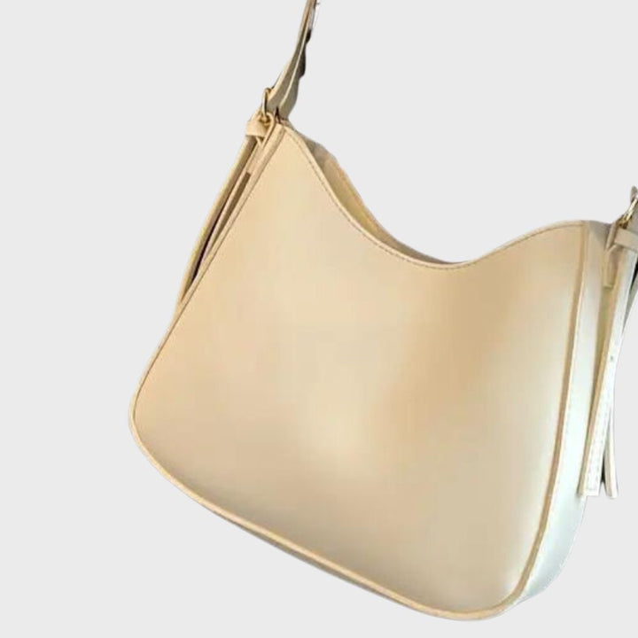 Minimalistisk crossbody handväska för kvinnor, elegant design, ergonomisk, flera färger, perfekt för alla tillfällen.