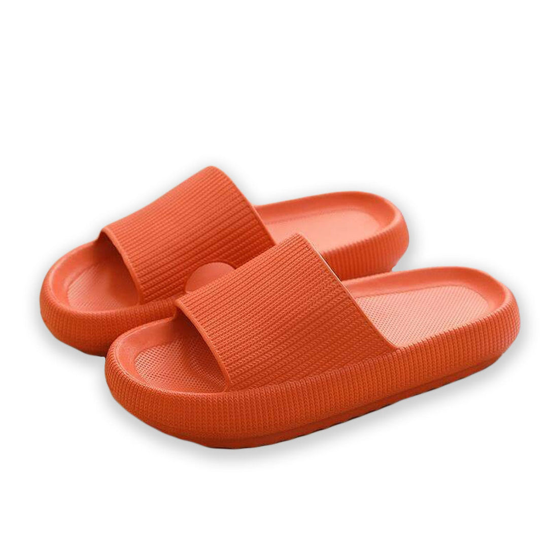 "Mjuka kuddtofflor för kvinnor i olika färger, ergonomiskt utformade för smärtlindring och halkfritt grepp."